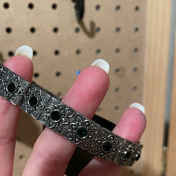 Silver stretchy bracelet with square charms accented by tiny EMERALDS.